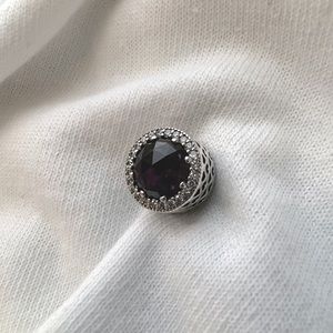 Authentic pandora 925 silver charm with purple crystal.